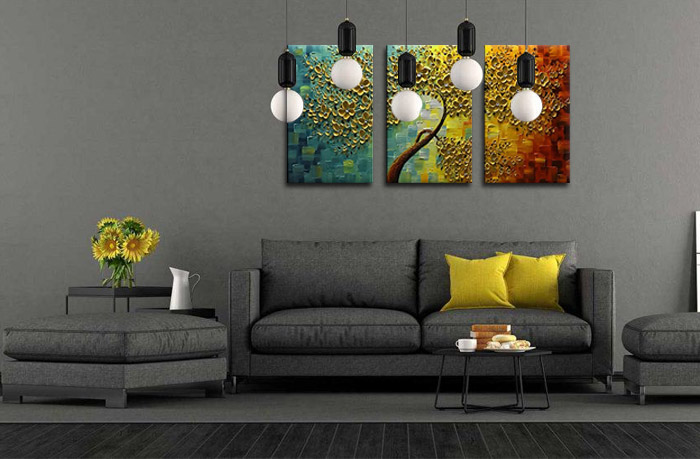 large gold floral canvas painting on living room wall